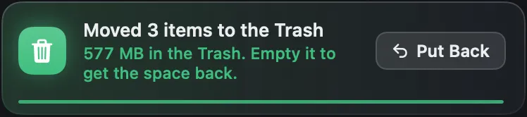 A notification from Strata: three items moved to the Trash, where 577 MB now waits until the Trash is emptied, with a Put Back button
